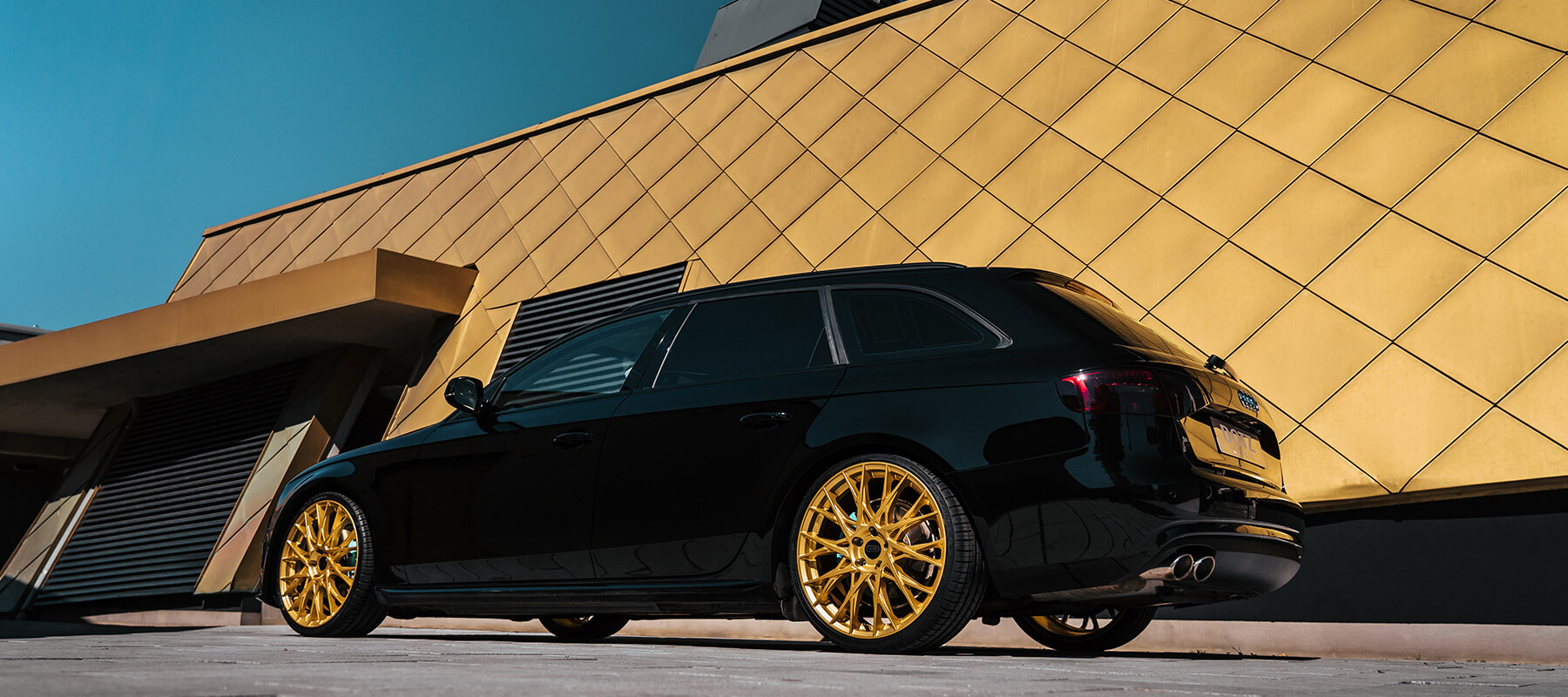 black car gold wheels